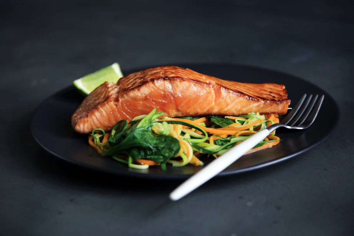 A fillet of wild salmon with herbs and lemon, ready for the grill